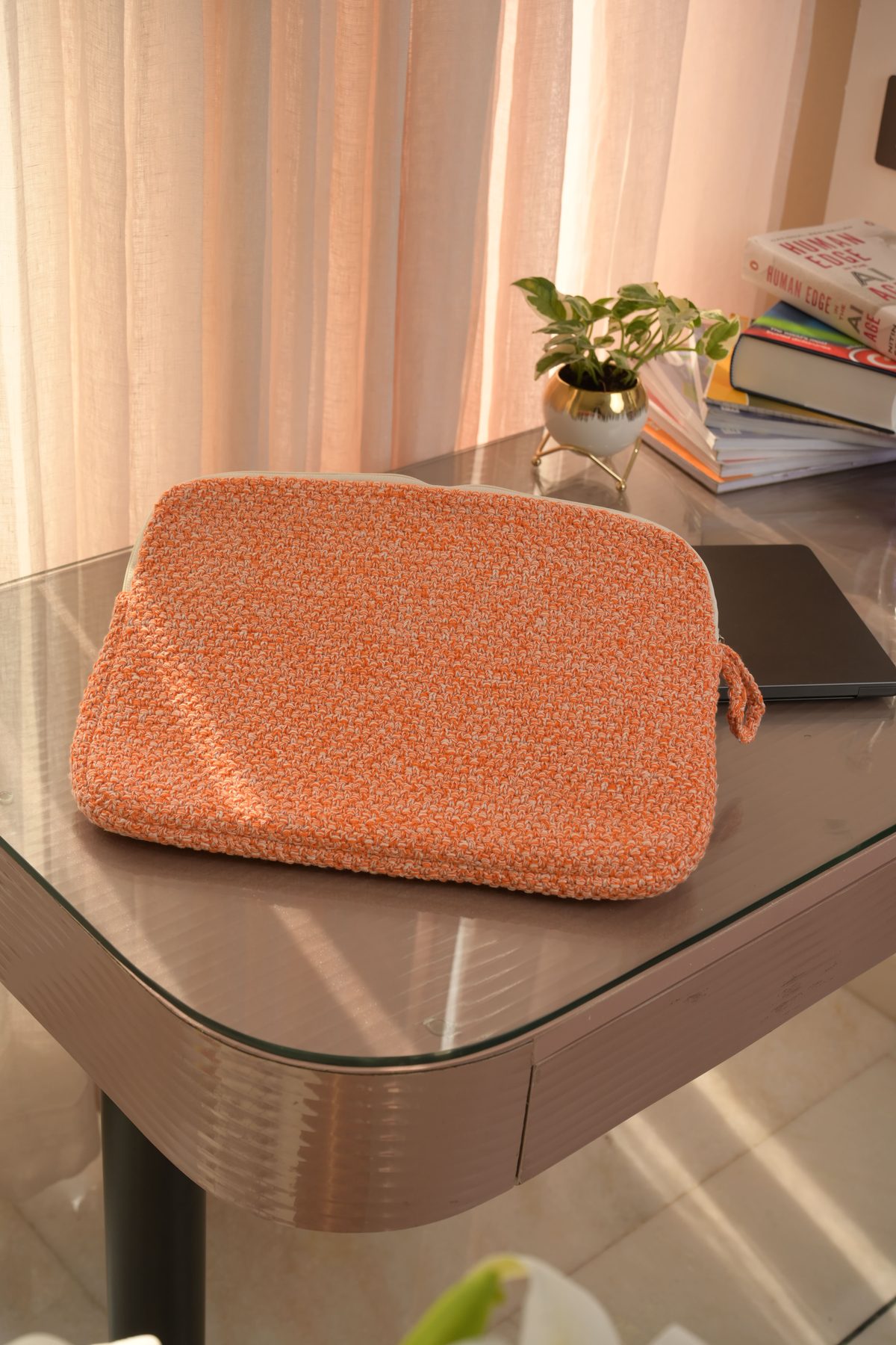 Orange Tweed Laptop Sleeve styled on a desk